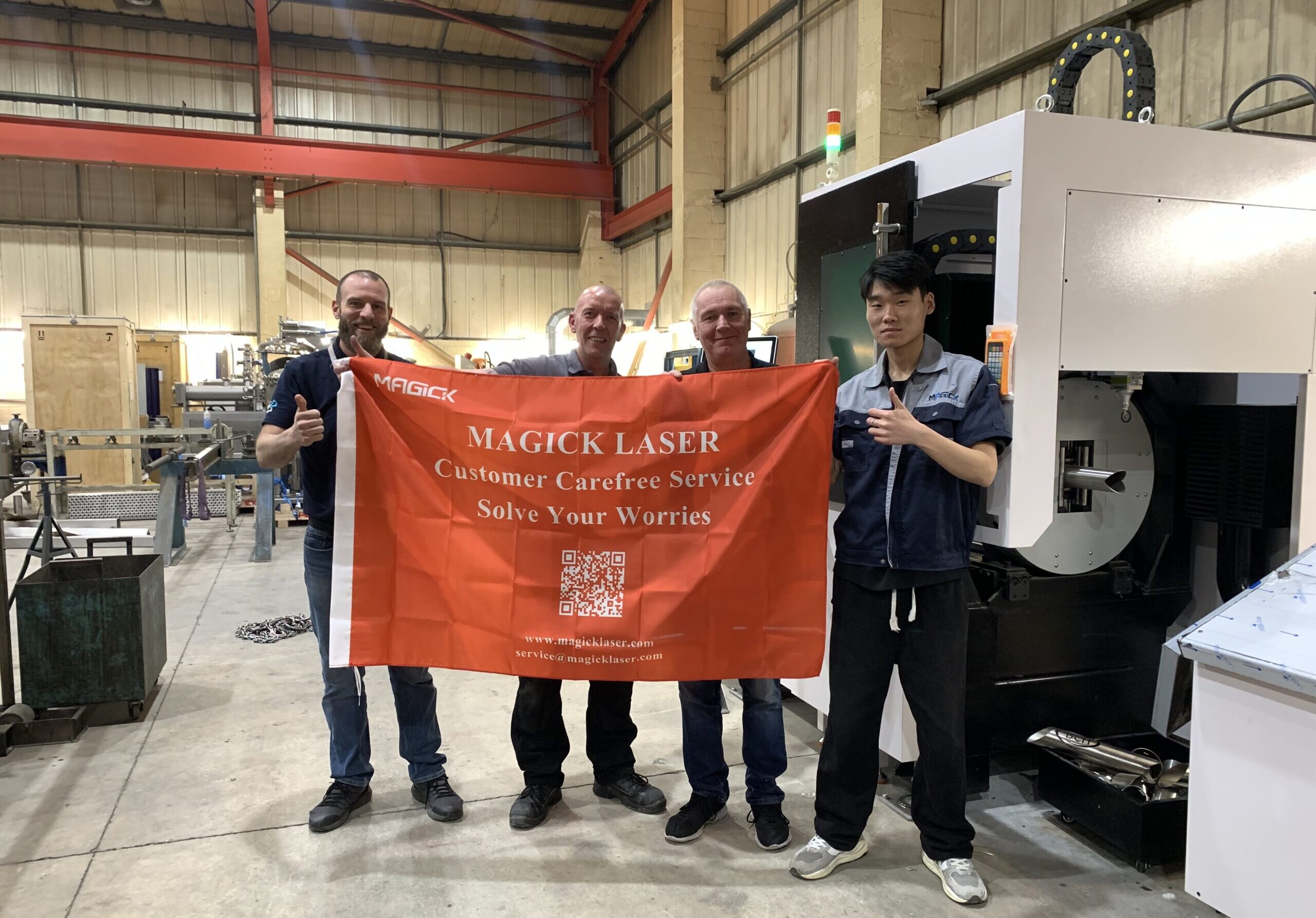 Magick Laser global after-sales engineering team providing on-site customer service.