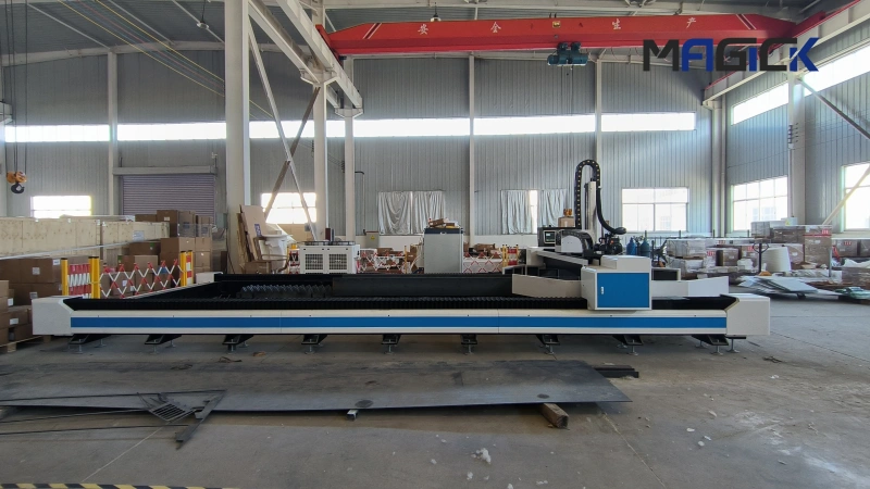 Full side view of the MK-HX structural steel laser cutting machine showing its long bed and gantry in the factory