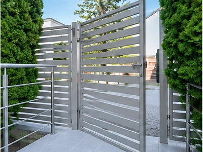 Architectural metalwork featuring steel stair railings and perforated sheet metal panels